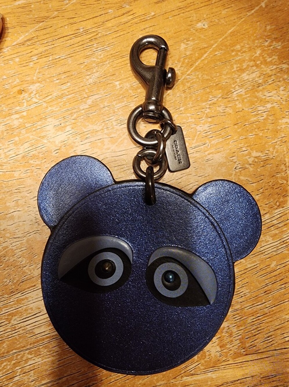 Coach Ace Face Bag Charm in metallic blue with dark metal hardware